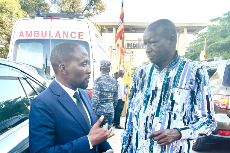 Ashaba Vincent with Hon Minister Lokki John Baptist.jpg